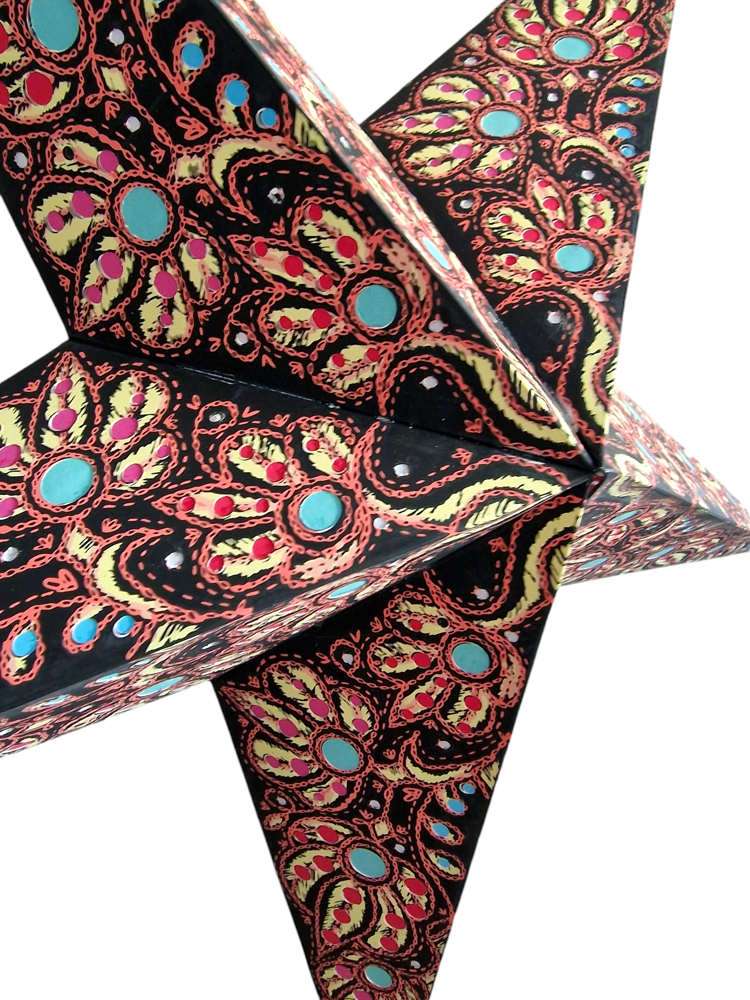 9. Adventsljusstjärna svart multifärgad vit bakgrund